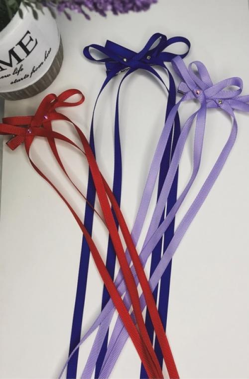 Двойные бантики на заколках - модель, которая активно набирает популярность. 05