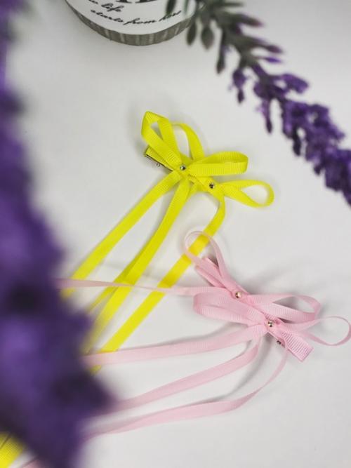 Двойные бантики на заколках - модель, которая активно набирает популярность. 02